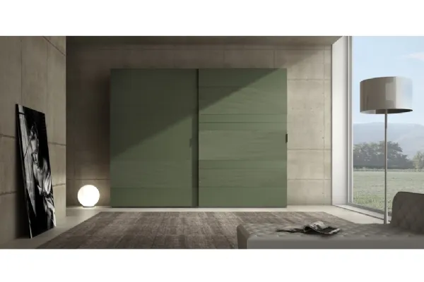 Armadio laccato opaco verde prussia con inserti in cemento Comp 06 di Voltan