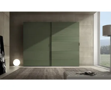 Armadio laccato opaco verde prussia con inserti in cemento Comp 06 di Voltan