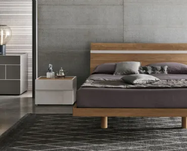 Letto con testiera  in materico nodato chiaro e inserto materico cemento Joker di Tomasella
